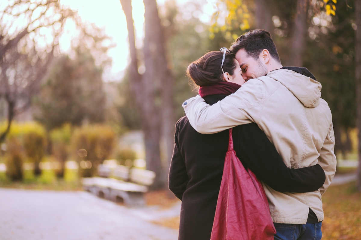 a couple kissing in the road