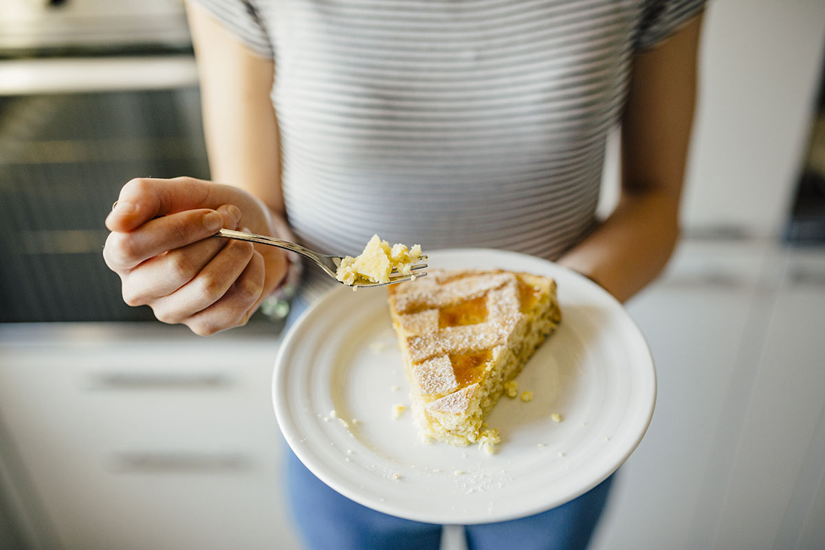 Woman Eating a Slice of Neapolitan Pastiera Pie
