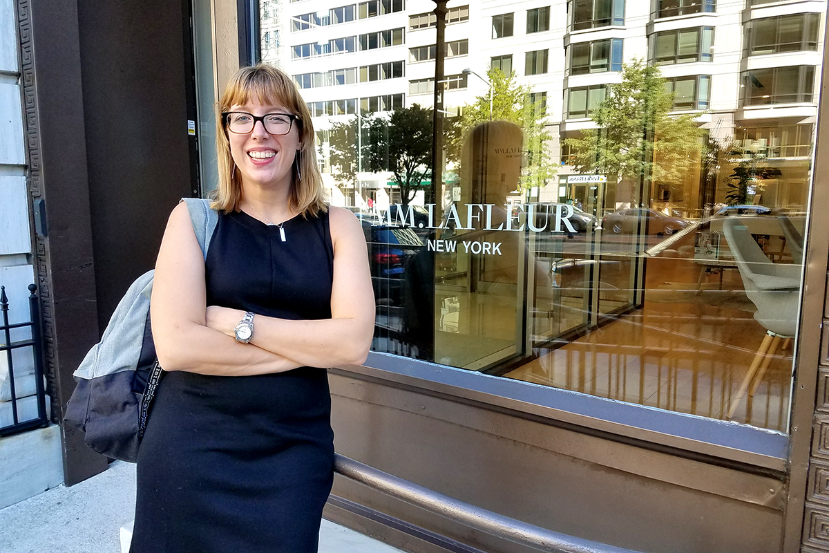 Lisa Rowan posing outside of MM.Lafleur in Washington D.C.