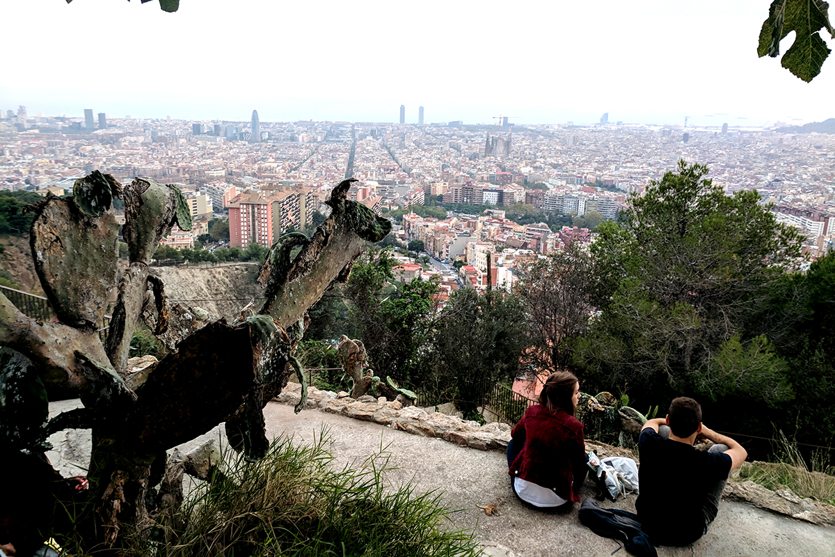 People watching the sunset at the Bunkers del Carmel in Barcelona, Spain