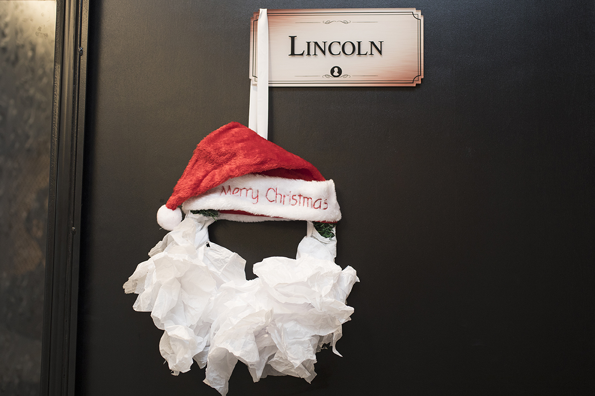 A santa wreath is an easy, inexpensive DIY Christmas decoration you can make with your children.