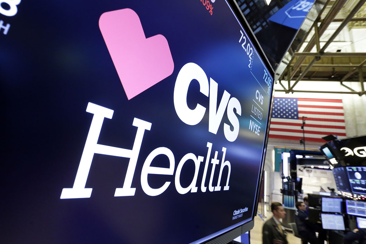 The CVS Health logo appears above a trading post on the floor of the New York Stock Exchange