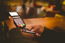 Hands holding credit card and paying