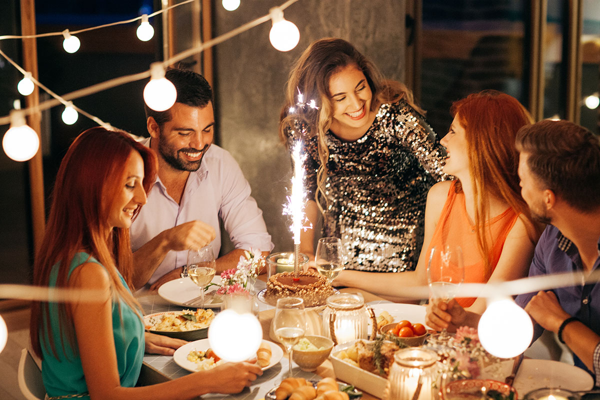 Friends having dinner party at home