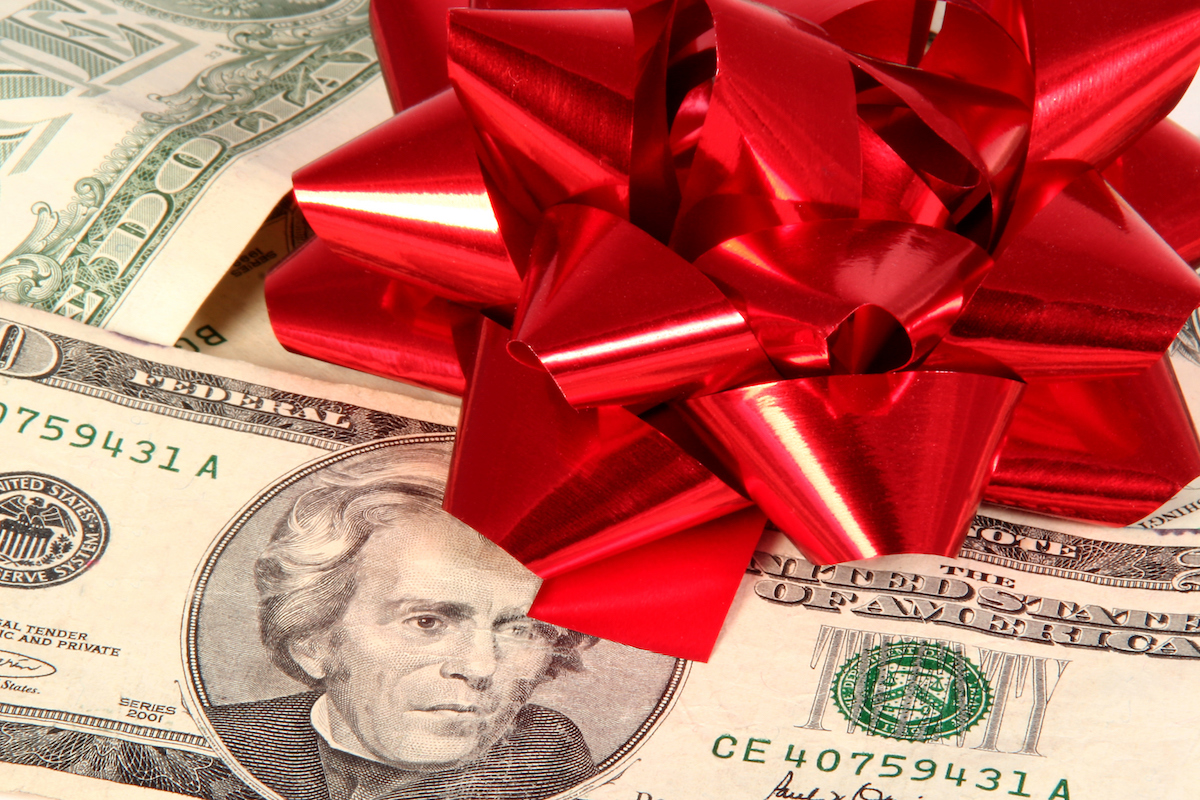 Christmas bow on money