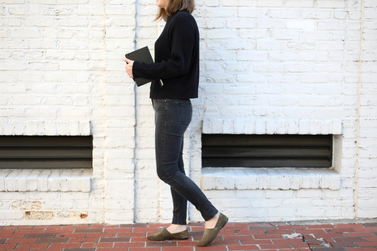 a girl walking with a journal