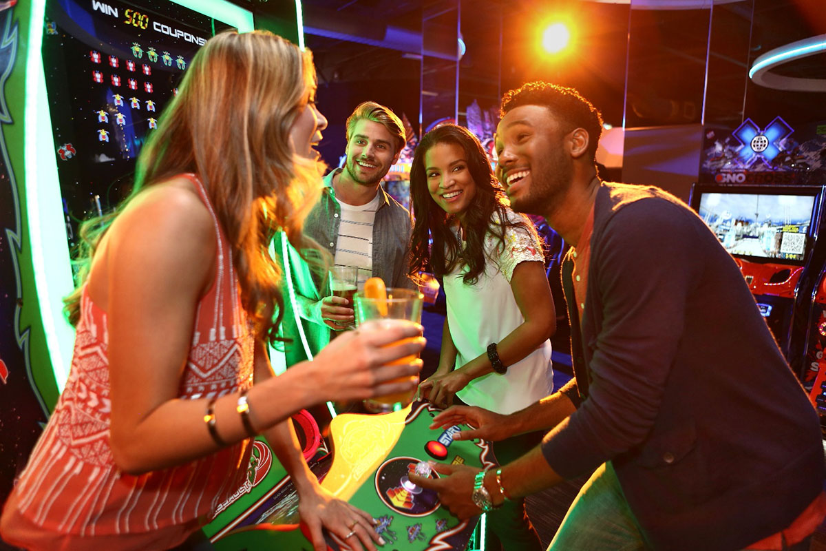 group playing games at dave and buster's