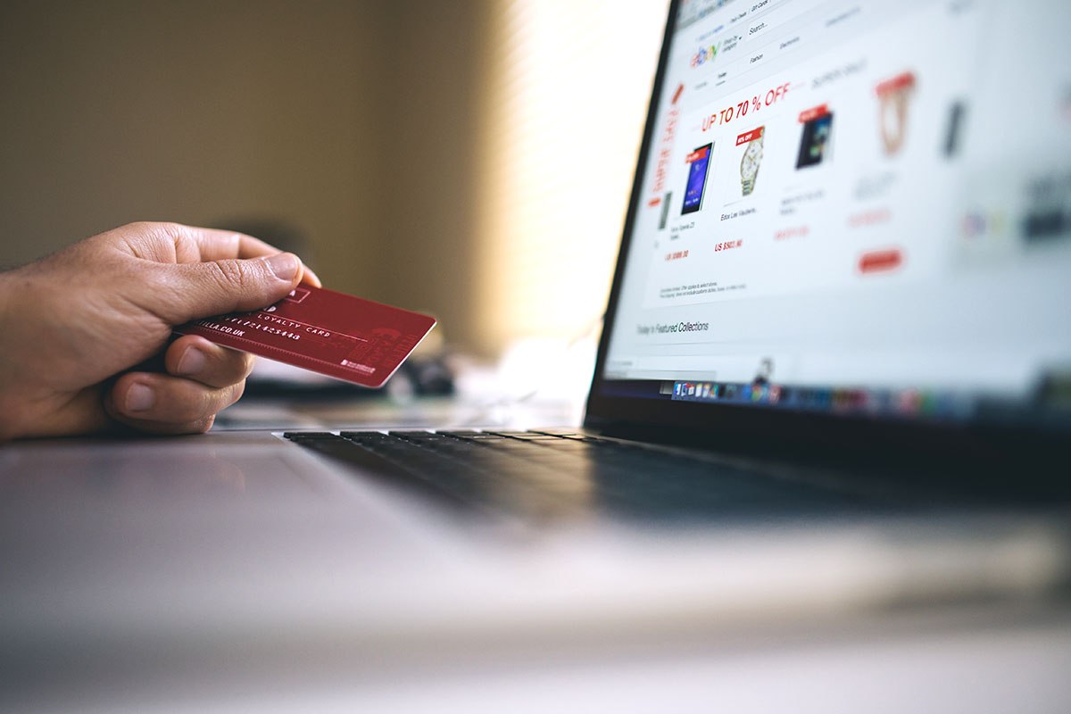 man shopping online from his laptop