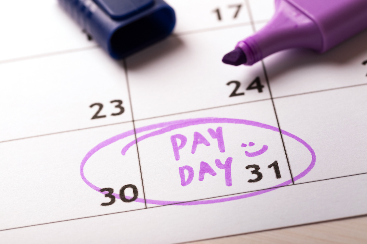 calendar with marker and circled day of salary