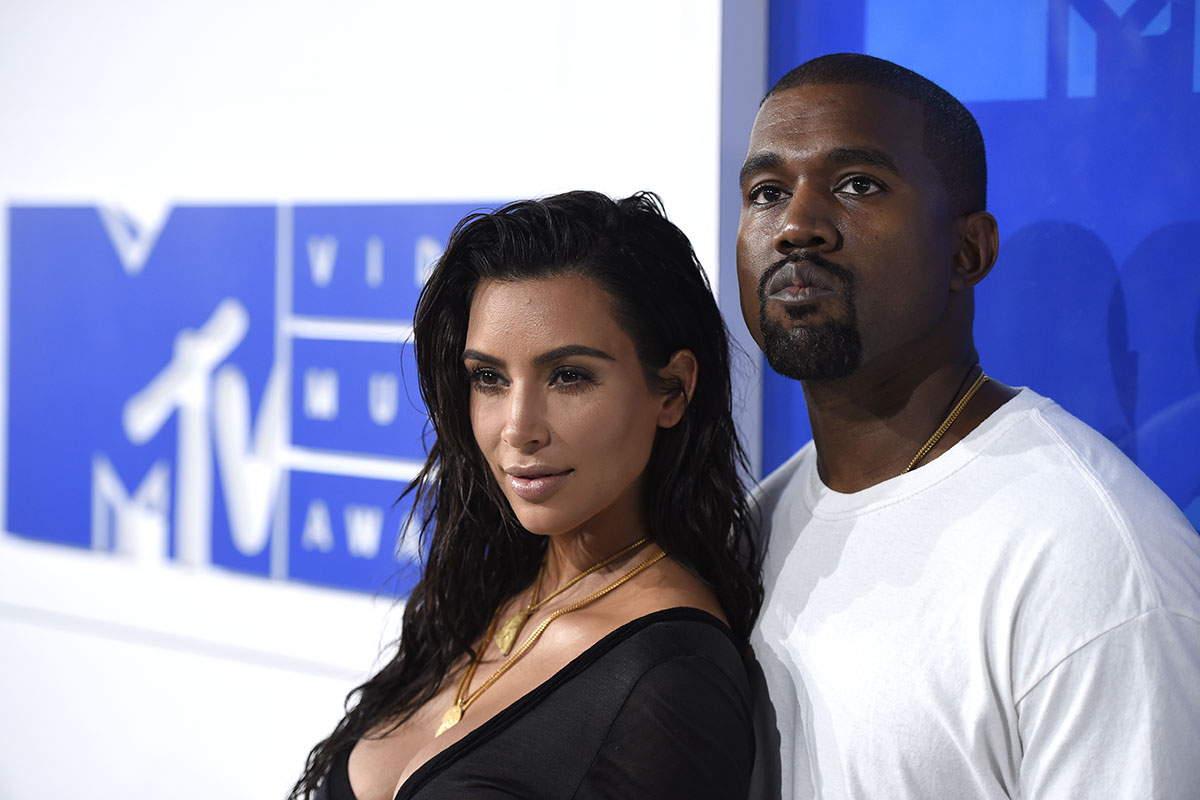 Kim Kardashian West, left, and Kanye West arrive at the MTV Video Music Awards in New York