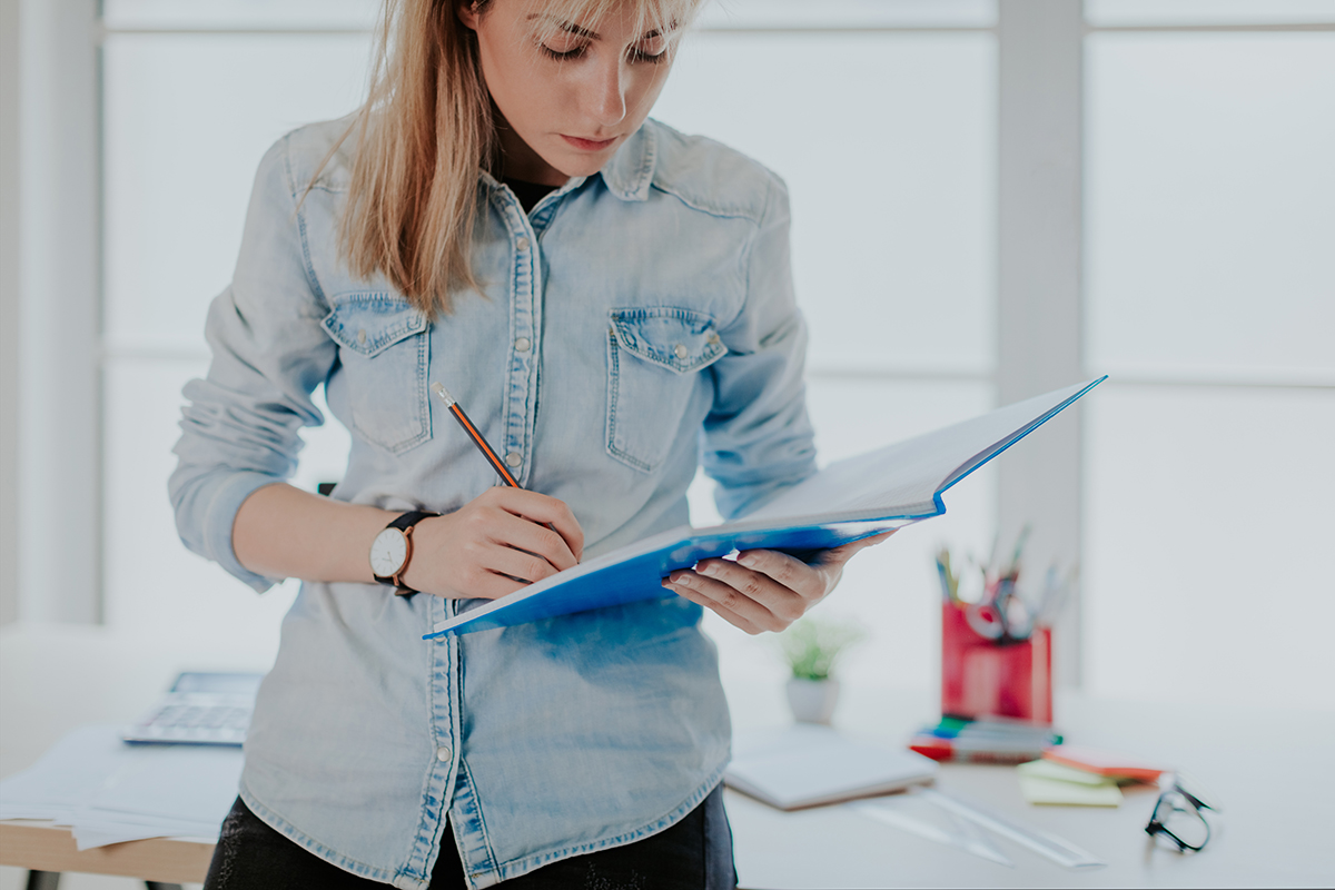 woman writing at home