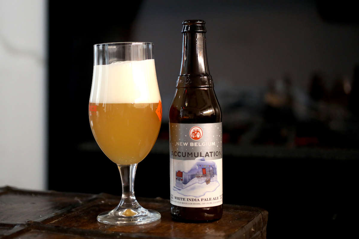 beer in a glass with a beer bottle next to it