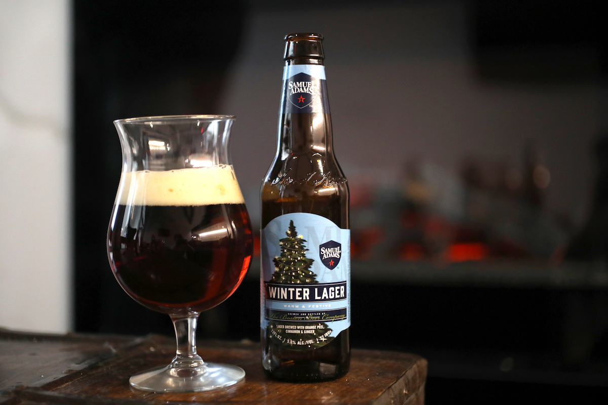 a beer in a glass with ta beer bottle next to it