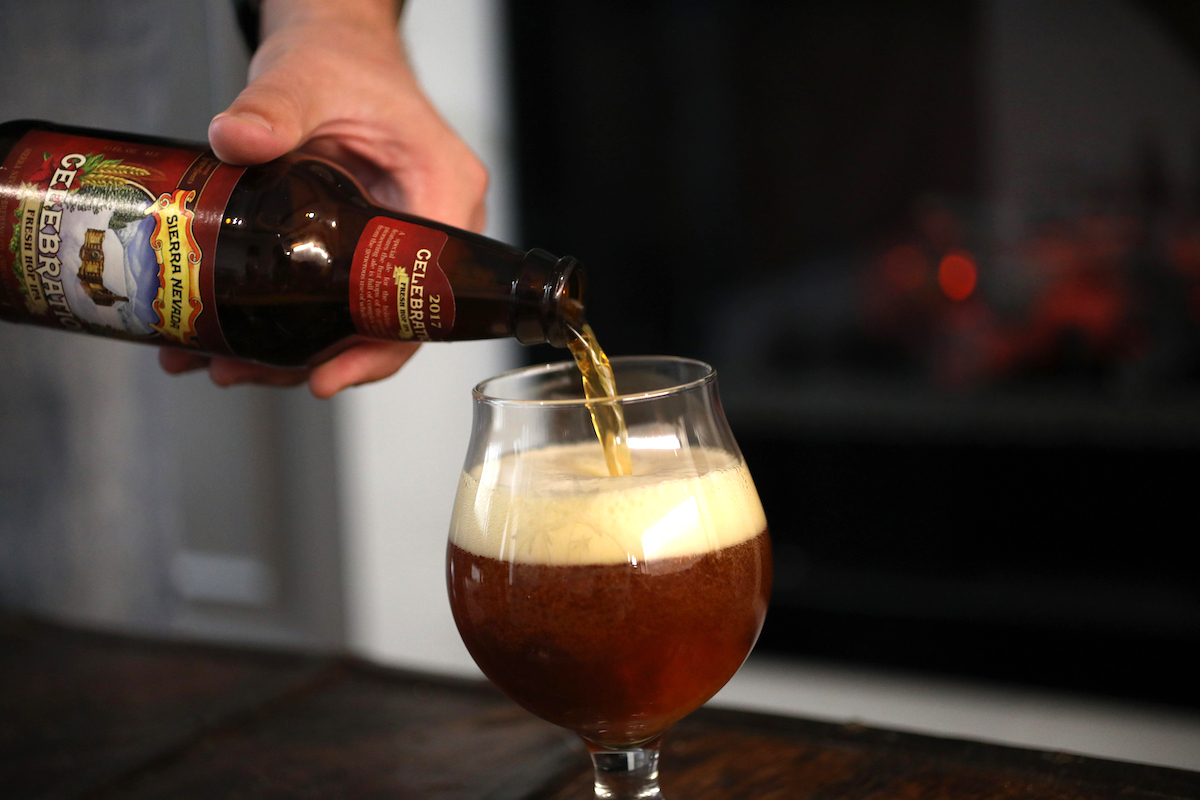 beer being poured into a glass