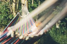 woman relaxing in hammock