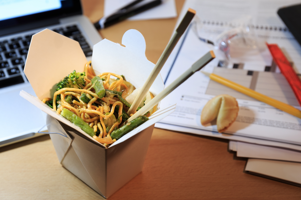 Chinese food box on the office desk.