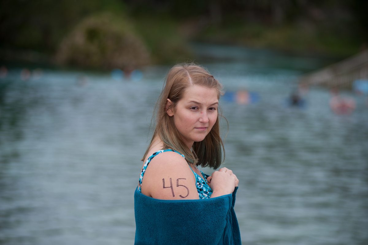 wrapped in a towel to stay warm, Brittany Manley, 23, a native of Weeki Wachee, gets ready to tryout to become a mermaid at Weeki Wachee Springs State Park on Saturday, January 13, 2018.