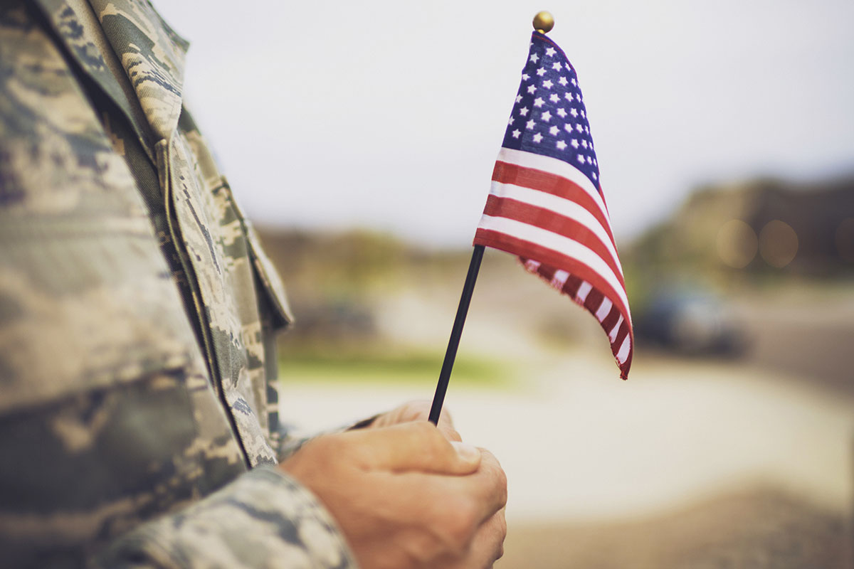American military soldier with flag.