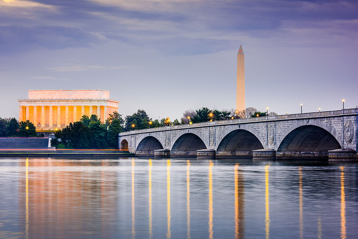 Washington DC, USA skyline on the Potomac River with Lincoln Memorial, Washington Memorial, and Arlington Memorial Bridge.