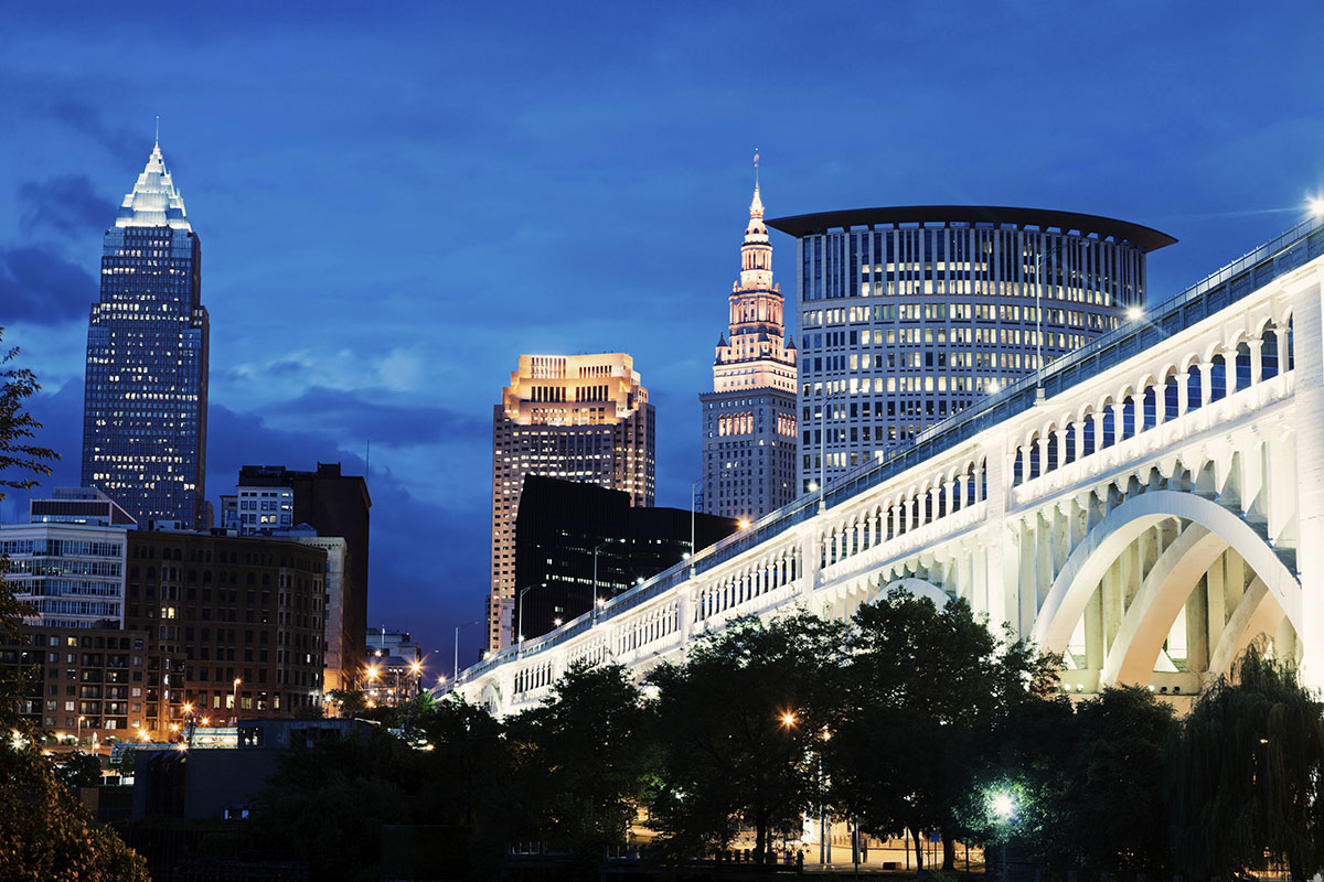 Cleveland skyline with bridge over Cuyahoga River.