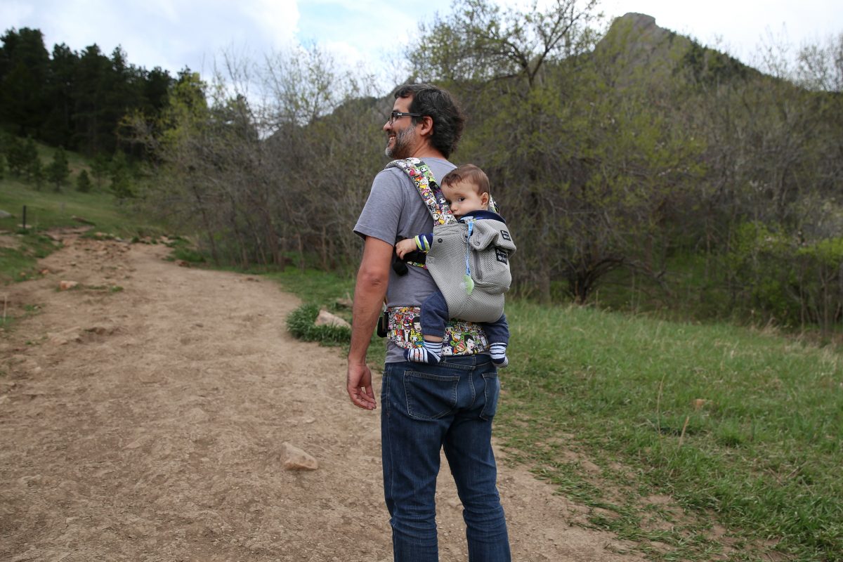 man carrying baby in the Lillebaby Complete Airflow baby carrier.
