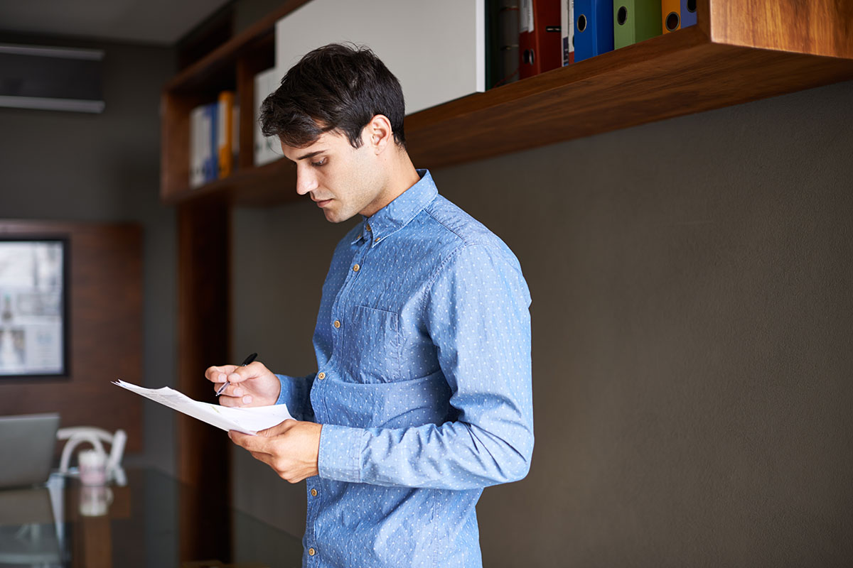 businessman looking over some paperwork