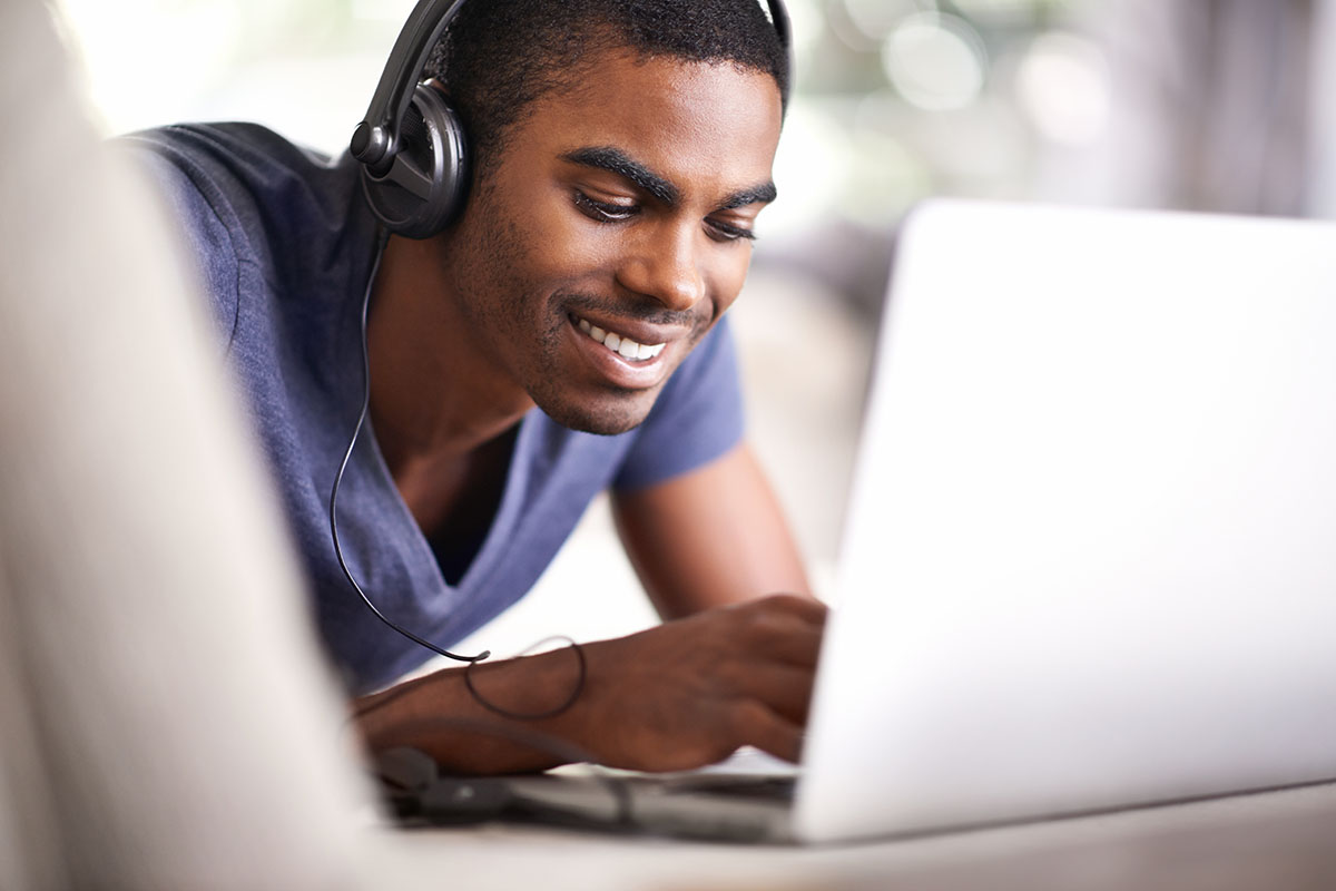 young man using his laptop at home