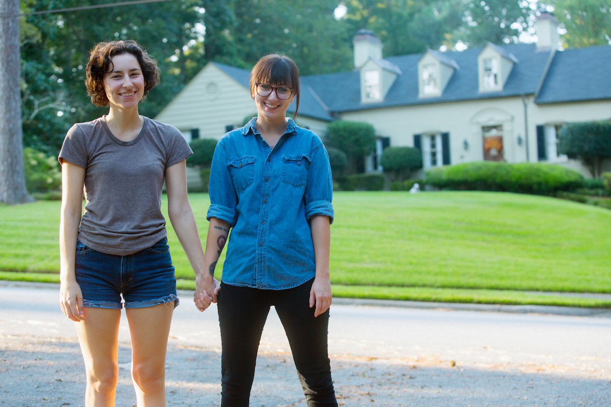 couple in front of house