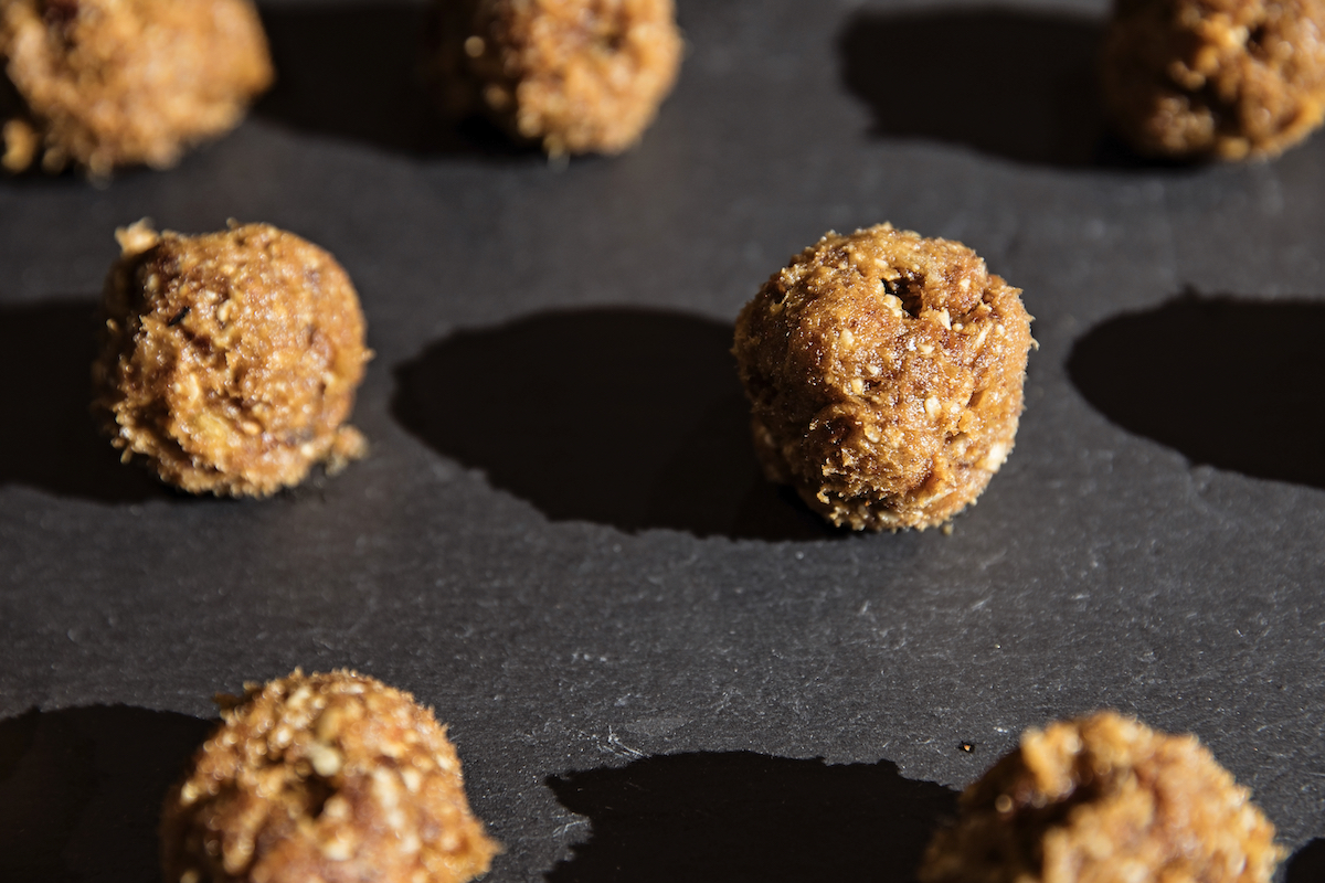 Date Energy Balls, approximately 15 medjool dates and ¾ cup of sunflower seeds into a food processor and pulse until everything looks gooey and delicious