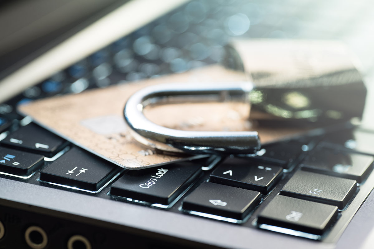 credit card and lock on computer keyboard