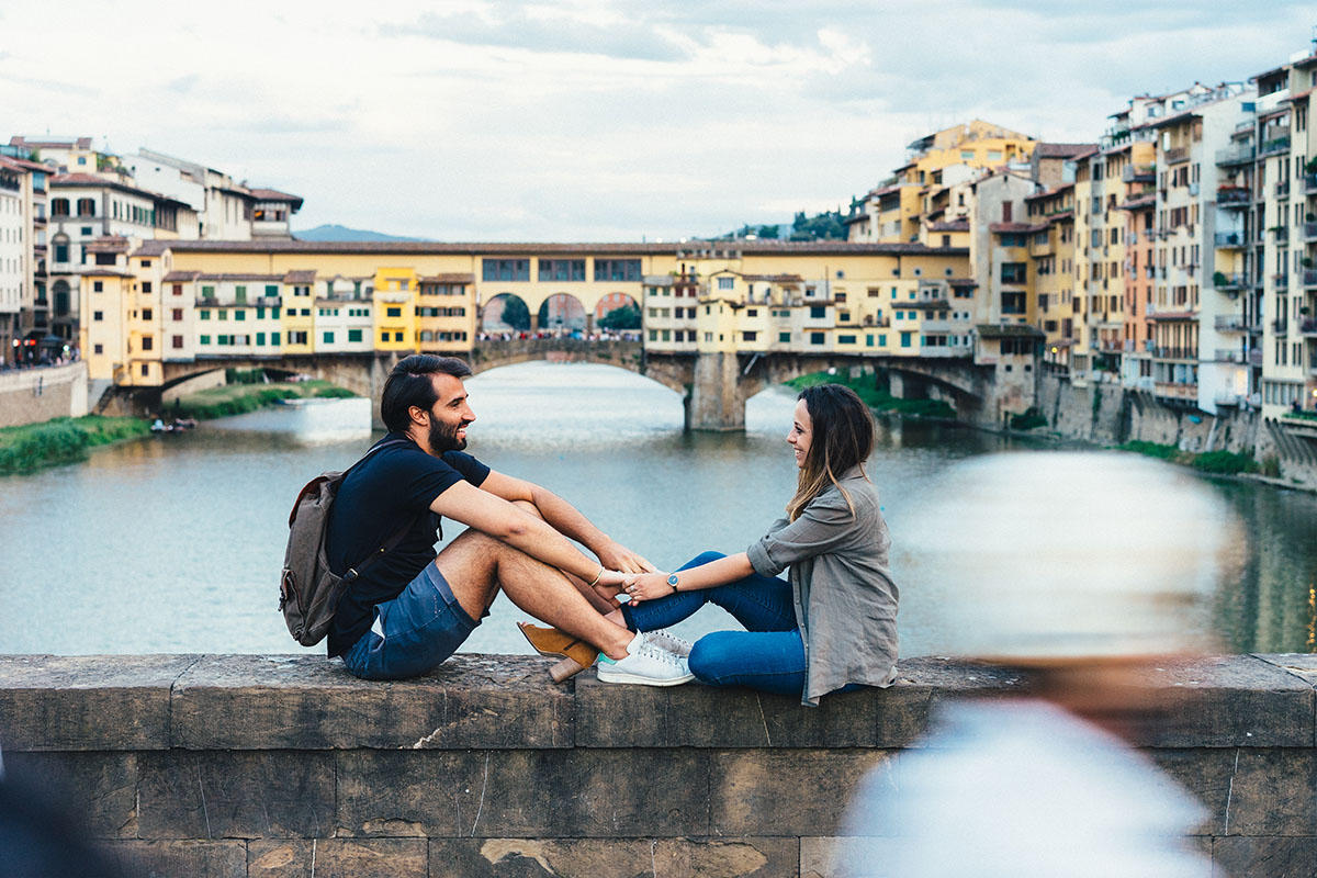 Couple in love near Ponte Vecchio bridge in Florence