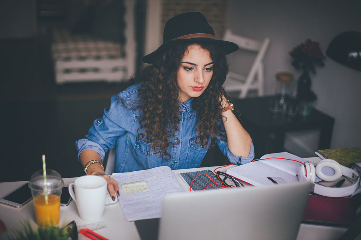 Woman using laptop in her modern home office