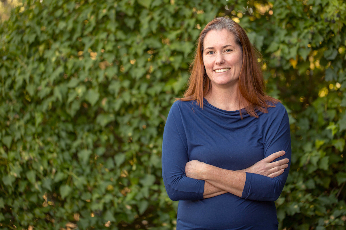 Milk Stork founder, Kate Torgersen of Lafayette, Calif., poses outside in front of greenery.