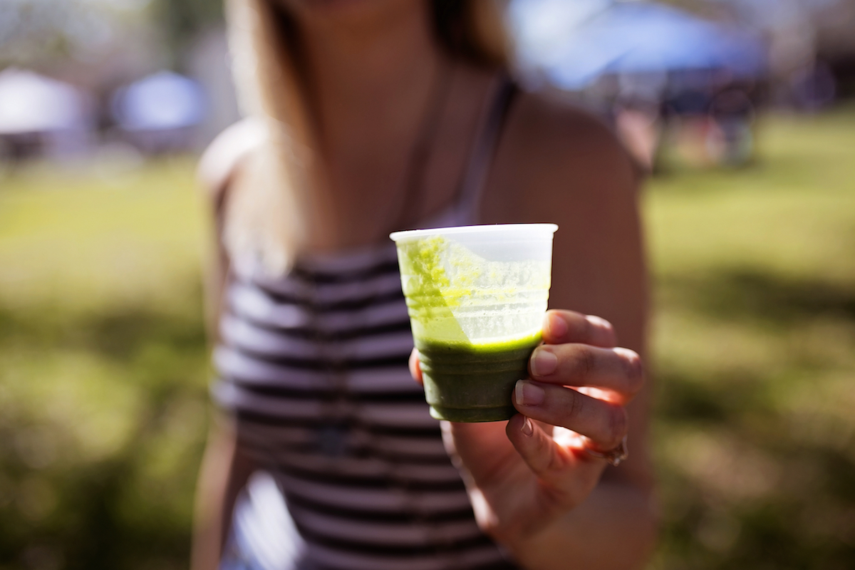 Tina Russell enjoys a collard green based shake made by Rays Vegan Soul in St Petersburg, Fla.