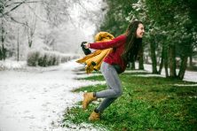A woman jumps from winter to spring in this photo illustration.