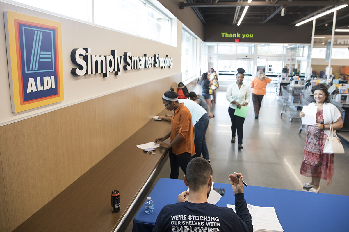 People apply for various positions at Aldi on Thursday, Sept. 21, 2017, in St. Petersburg, Florida.
