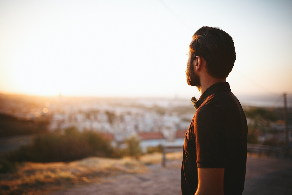 Portrait of young man looking away.