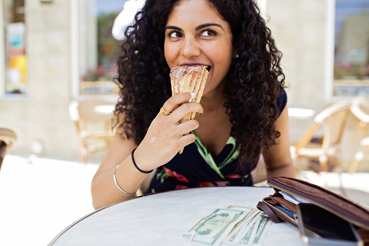 Sushil Cheema enjoys gelato while making a run to the ATM in St. Petersburg, Fla.