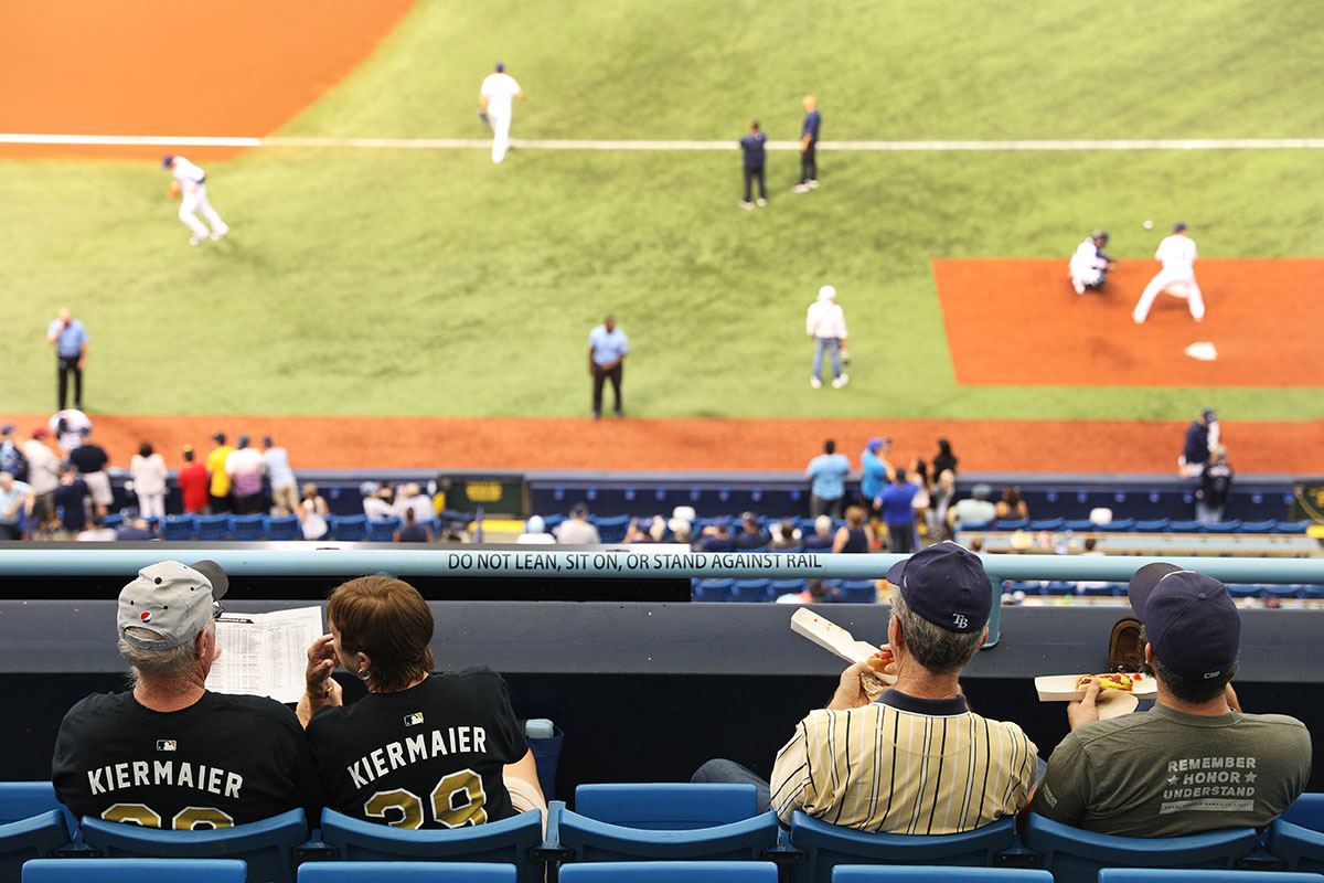 People sit in the cheap seats during a Tampa Bay Rays baseball game inside Tropicana Field on Thursday, August 25, 2017 in St. Petersburg, Florida.