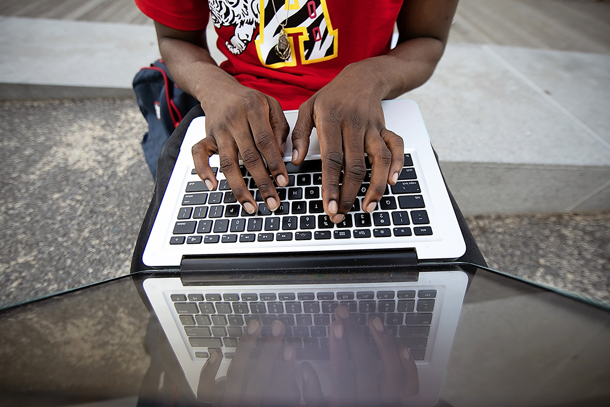 man working on laptop in new york