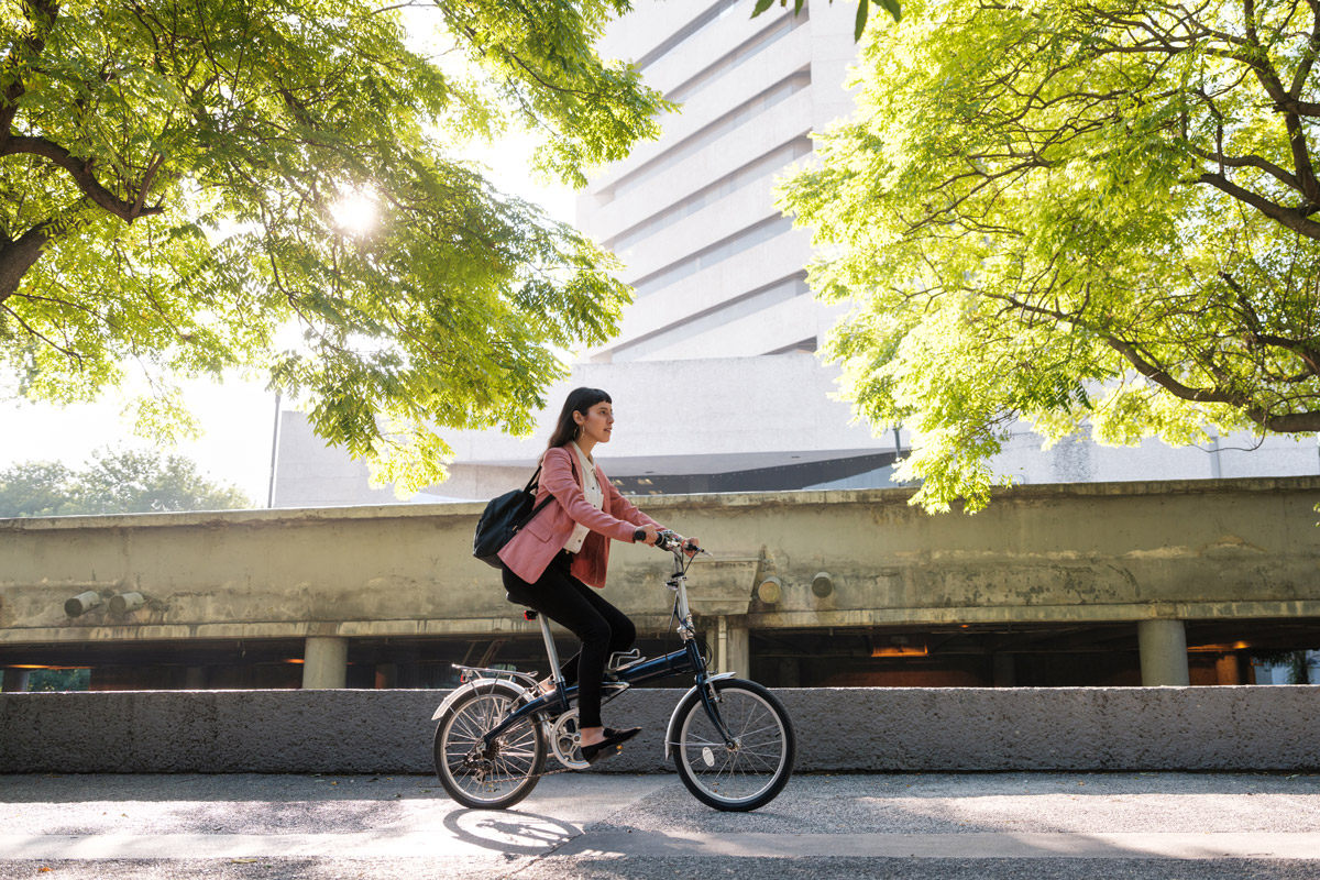 A woman rides her bike to work.