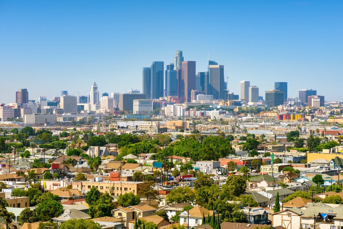 Los Angeles skyline with homes pictured in the foreground