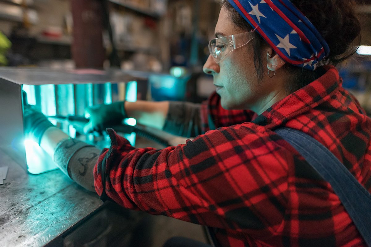 Vanessa Carman, a journeywoman sheet metal worker, works on job sites all over Seattle, WA. Here, she is spot welding at Hermanson Company in Kent, WA. Meenu Bhardwaj for The Penny Hoarder