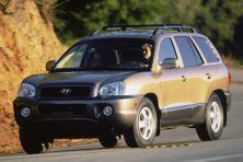 a 2002 hyundai tuscon driving on the road