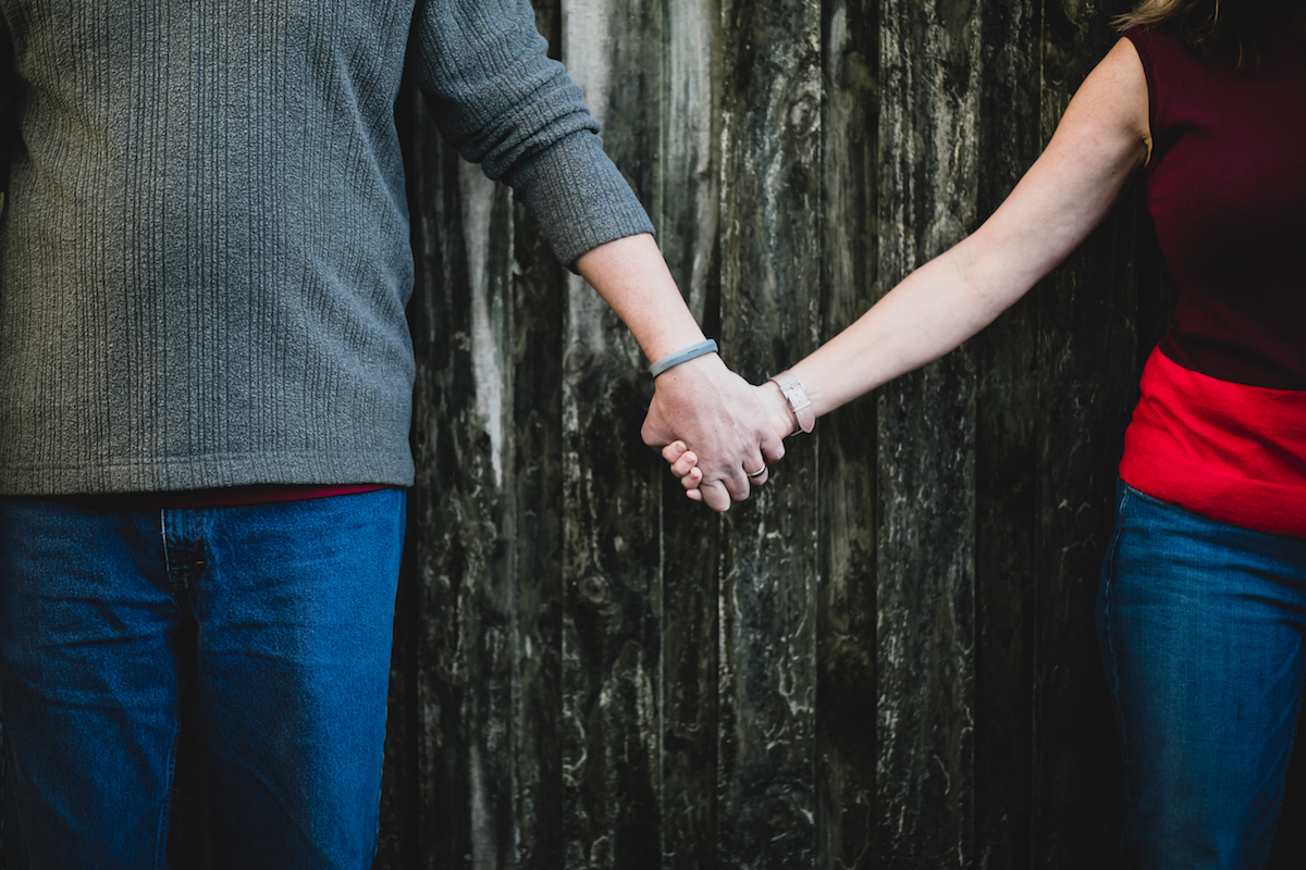 close up of couple holding hands