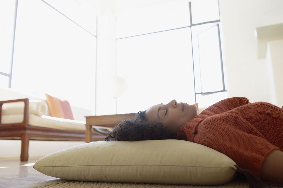 Woman napping on living room floor