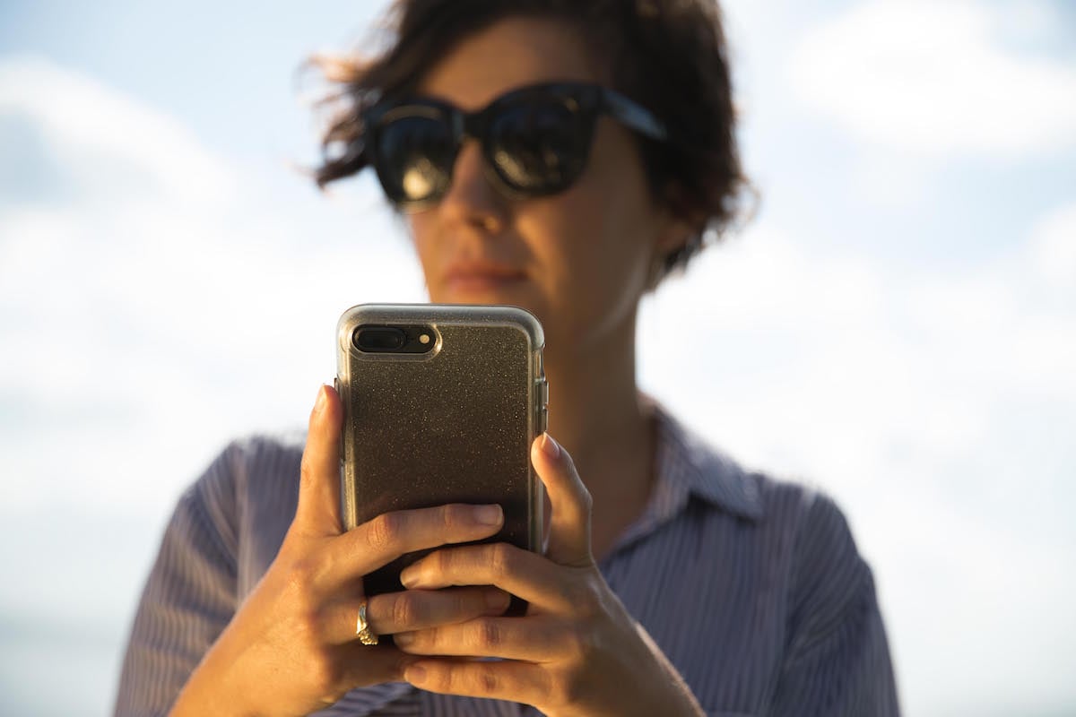 woman holding smart phone