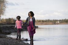 A daughter and mother walk near the water in Fairbanks, Alaska.