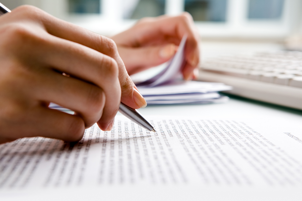 Close-up of secretary's hands doing paperwork