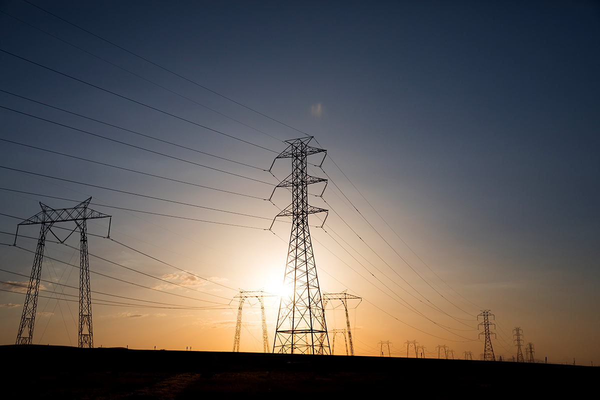 Power lines cross over Kettleman City, west of Visalia, Calif., on May 23, 2018.